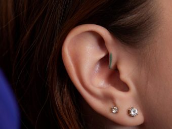 A woman with double ear piercing