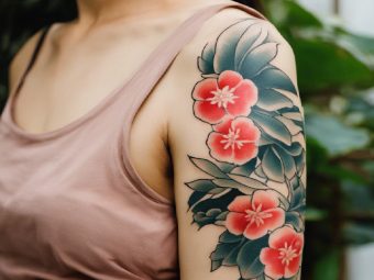 A woman with a Tebori tattoo design on the upper arm. Stable Diffusion/StyleCraze Design Team